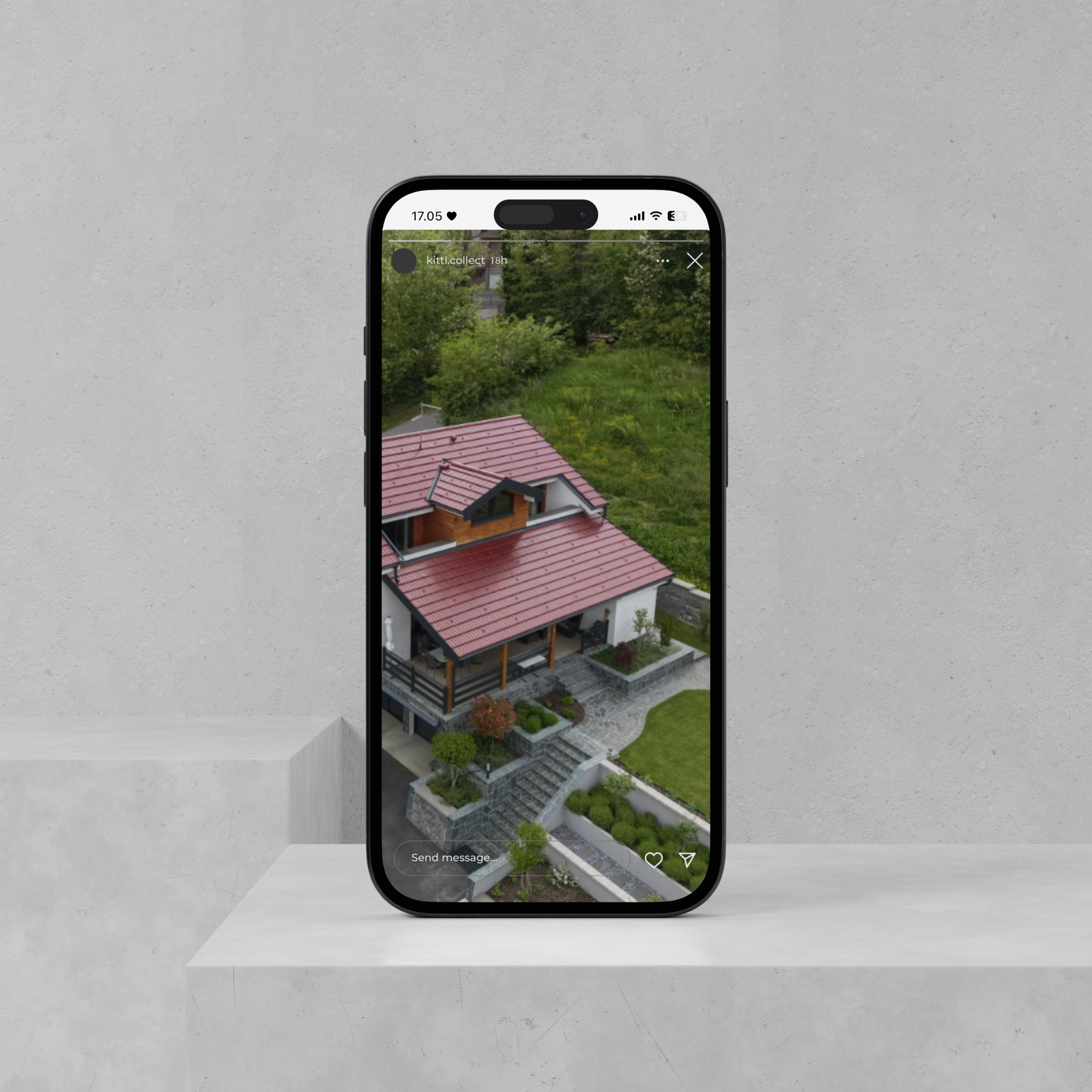 Smartphone showing a PARTAS Reel with an aerial view of a finished house