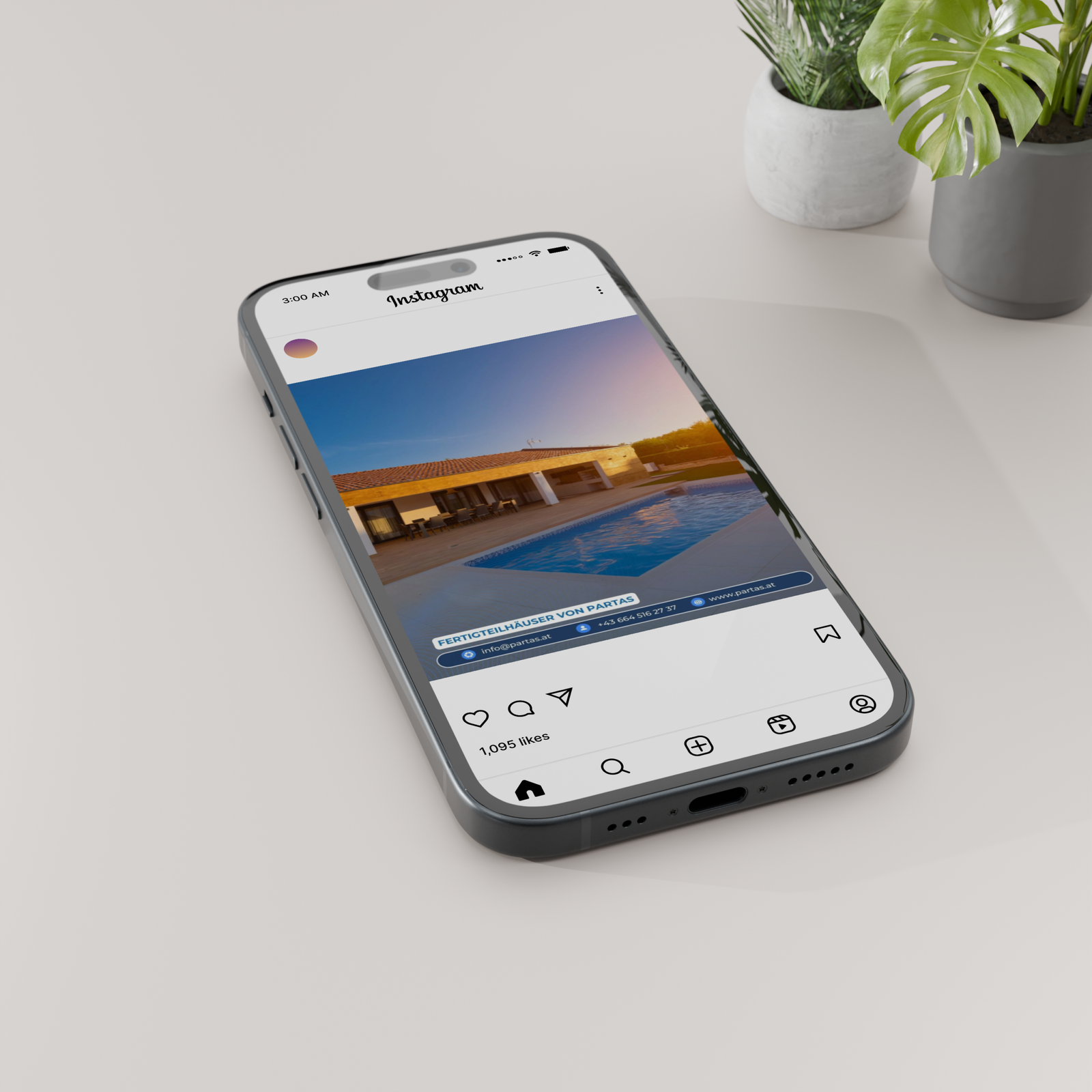 Smartphone showing a PARTAS social post of a modern house at dusk