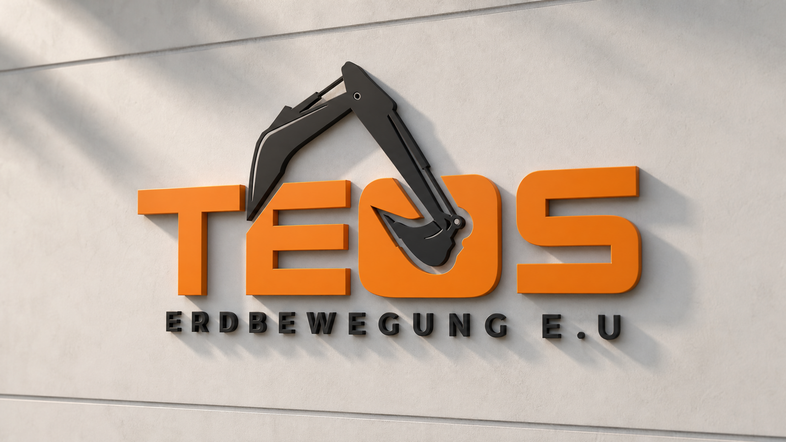 TEOS Erdbewegung logo as a 3D orange sign on a light wall