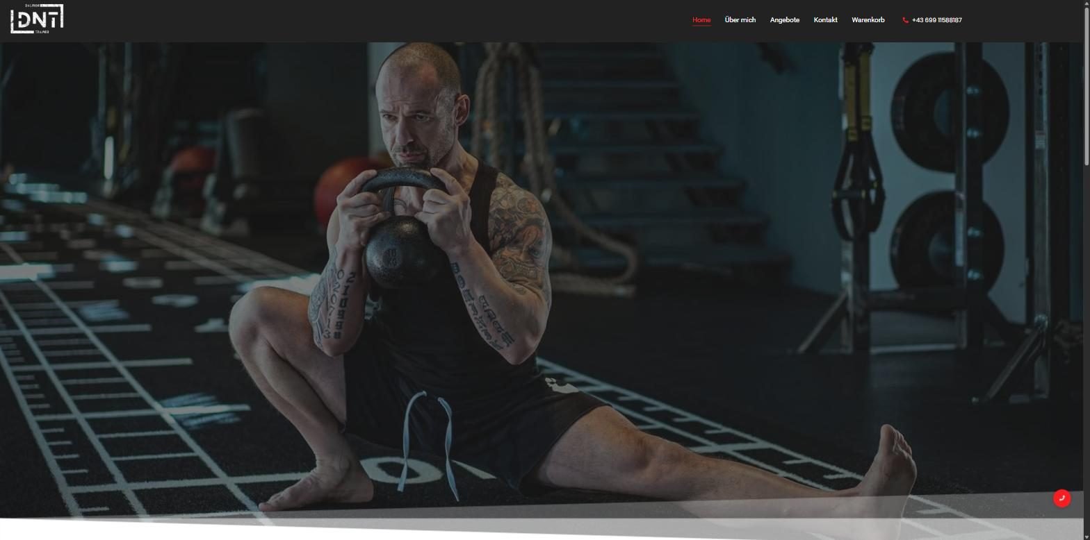 DNT Fitness website hero with the coach training in a dark gym